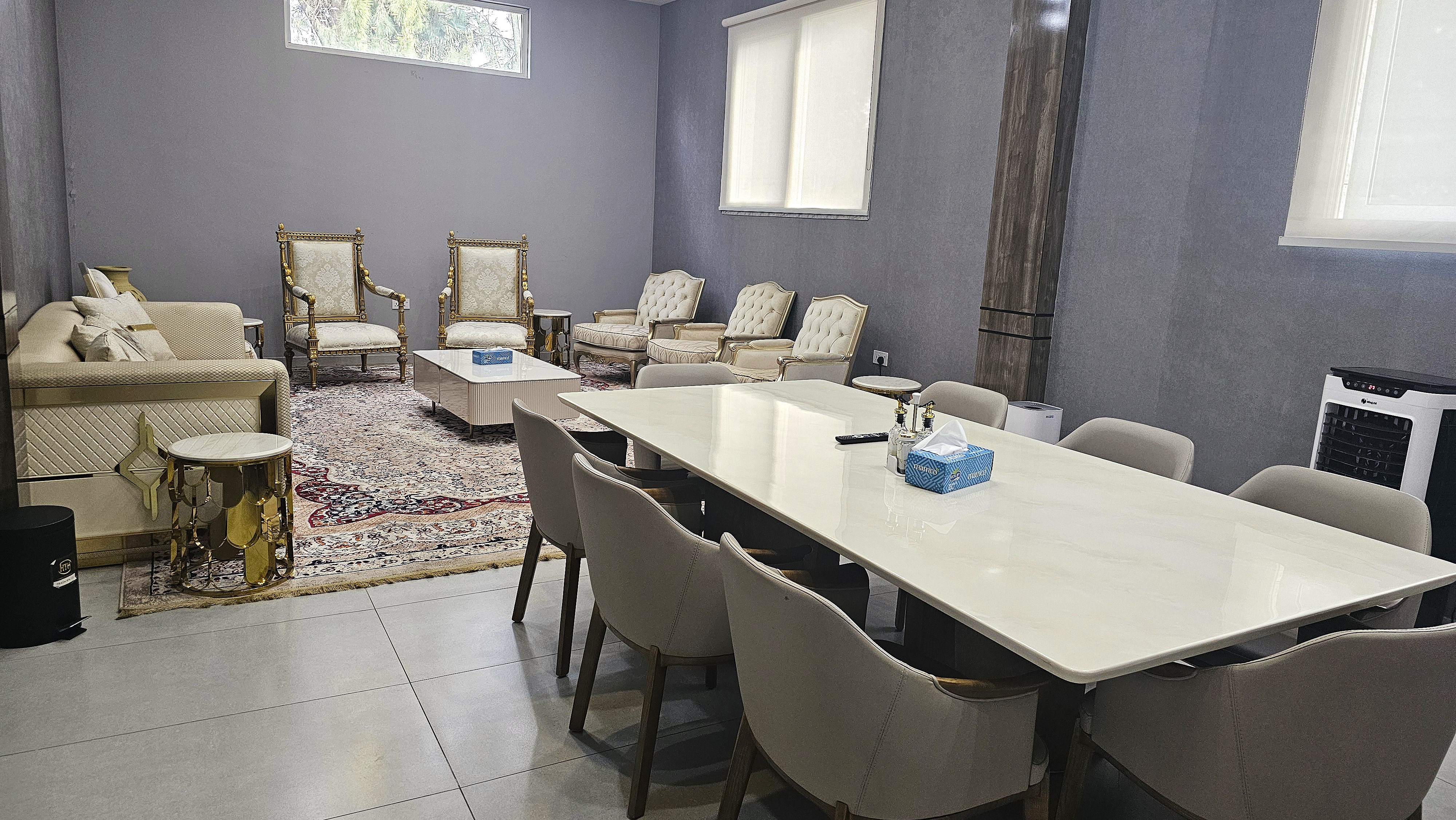 VIP room one at Musk with sofas, dining table and TV