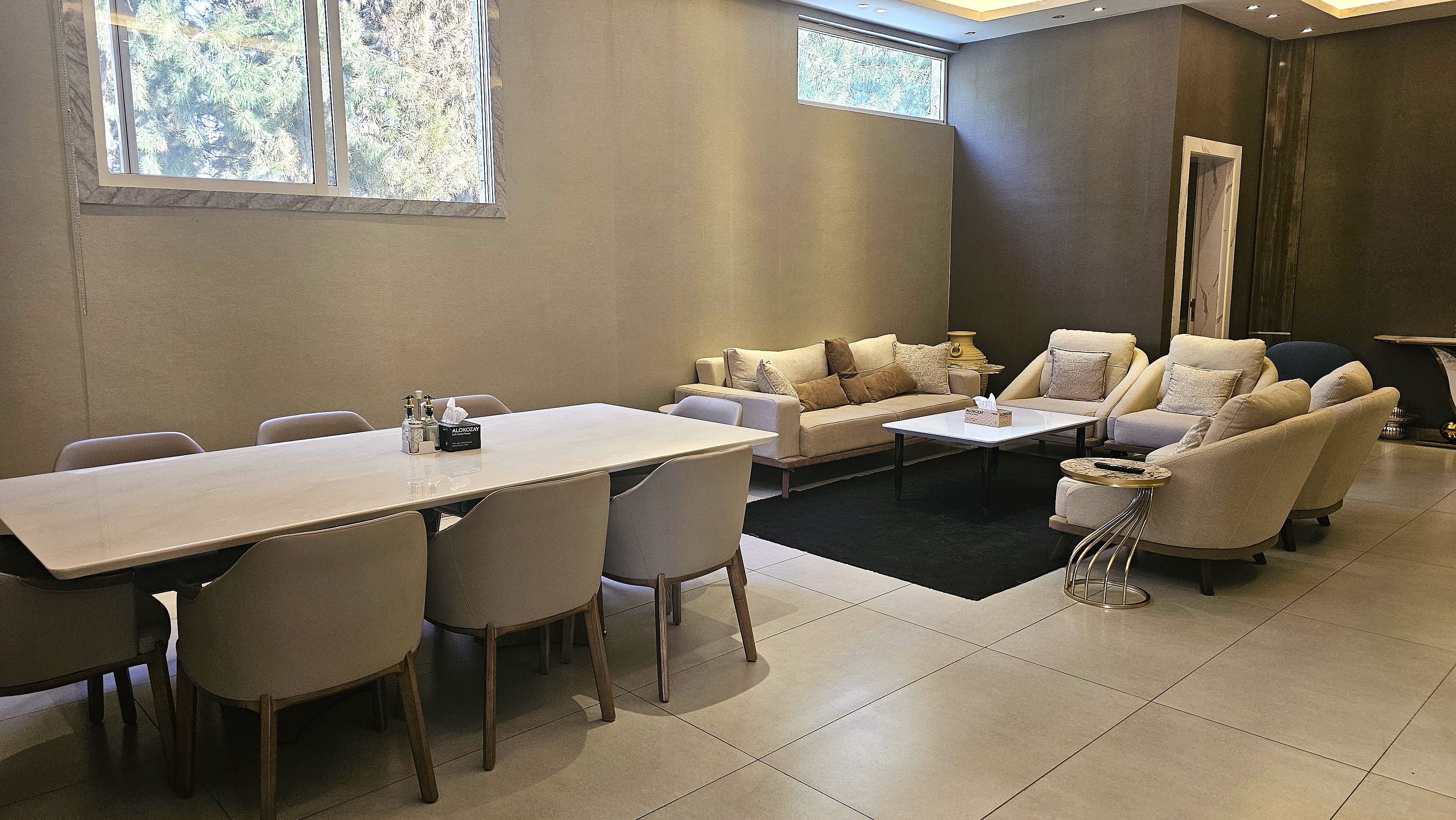VIP room two at Musk with sofas, dining table, TV and private bathroom